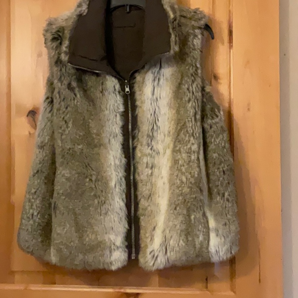 Reversible faux fur vest size medium zip front with pockets